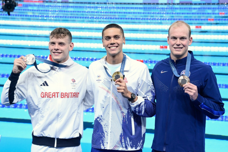 Popovici David ( ROU ) , Matthew Richards ( GBR ) and Luke Hobbson ( USA ) celebrate with medals during the 2024 Olympic