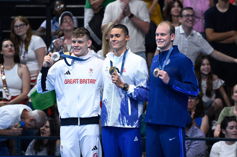 Popovici David ( ROU ) , Matthew Richards ( GBR ) and Luke Hobbson ( USA ) celebrate with medals during the 2024 Olympic