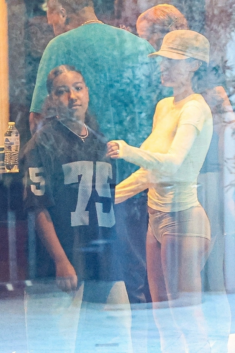 *PREMIUM-EXCLUSIVE* Bianca Censori Holds Step Daughter, North West, close while they enjoy family movie day with Kanye West seeing R rated film "Deadpool &amp; Wolverine"