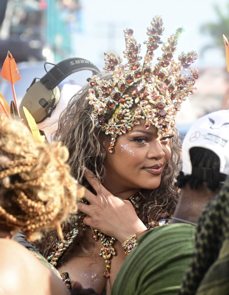 *EXCLUSIVE* Singer Rihanna Stuns at Carnival Festival In Barbados showcasing her 2024 outfit in a bejeweled bikini as she poses with police and fans