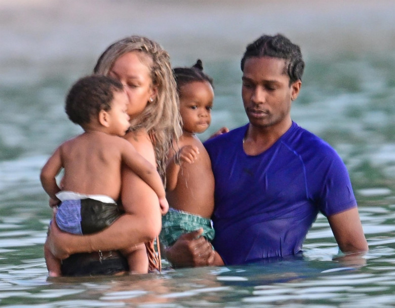 *PREMIUM-EXCLUSIVE* *MUST CALL FOR PRICING* The Grammy-Winning Superstar Rihanna wears her sultry black maxi beach dress watching the sun go down and taking a dip in the sea with her beau Asap Rocky during their family holiday in Barbados.**PICTURES TAKE