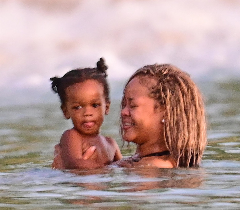 *PREMIUM-EXCLUSIVE* *MUST CALL FOR PRICING* The Grammy-Winning Superstar Rihanna wears her sultry black maxi beach dress watching the sun go down and taking a dip in the sea with her beau Asap Rocky during their family holiday in Barbados.**PICTURES TAKE