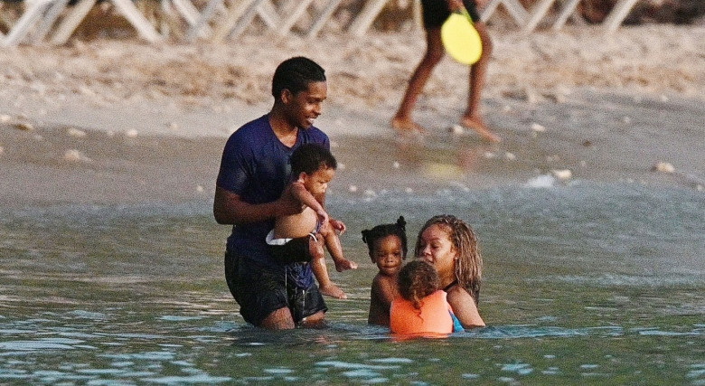 *PREMIUM-EXCLUSIVE* *MUST CALL FOR PRICING* The Grammy-Winning Superstar Rihanna wears her sultry black maxi beach dress watching the sun go down and taking a dip in the sea with her beau Asap Rocky during their family holiday in Barbados.**PICTURES TAKE