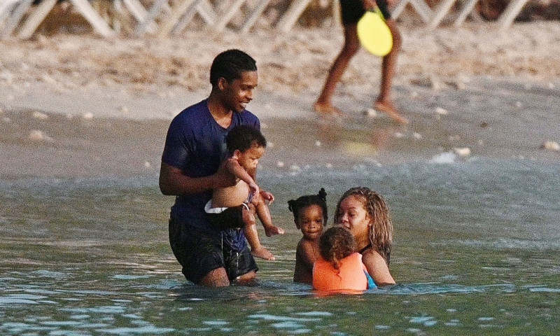 *PREMIUM-EXCLUSIVE* *MUST CALL FOR PRICING* The Grammy-Winning Superstar Rihanna wears her sultry black maxi beach dress watching the sun go down and taking a dip in the sea with her beau Asap Rocky during their family holiday in Barbados.**PICTURES TAKE