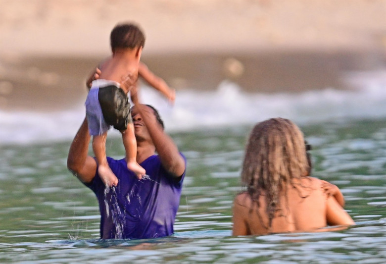 *PREMIUM-EXCLUSIVE* *MUST CALL FOR PRICING* The Grammy-Winning Superstar Rihanna wears her sultry black maxi beach dress watching the sun go down and taking a dip in the sea with her beau Asap Rocky during their family holiday in Barbados.**PICTURES TAKE