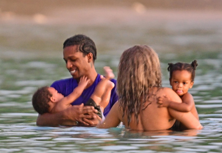 *PREMIUM-EXCLUSIVE* *MUST CALL FOR PRICING* The Grammy-Winning Superstar Rihanna wears her sultry black maxi beach dress watching the sun go down and taking a dip in the sea with her beau Asap Rocky during their family holiday in Barbados.**PICTURES TAKE