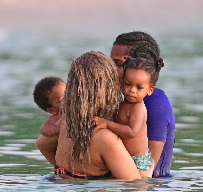 *PREMIUM-EXCLUSIVE* *MUST CALL FOR PRICING* The Grammy-Winning Superstar Rihanna wears her sultry black maxi beach dress watching the sun go down and taking a dip in the sea with her beau Asap Rocky during their family holiday in Barbados.**PICTURES TAKE