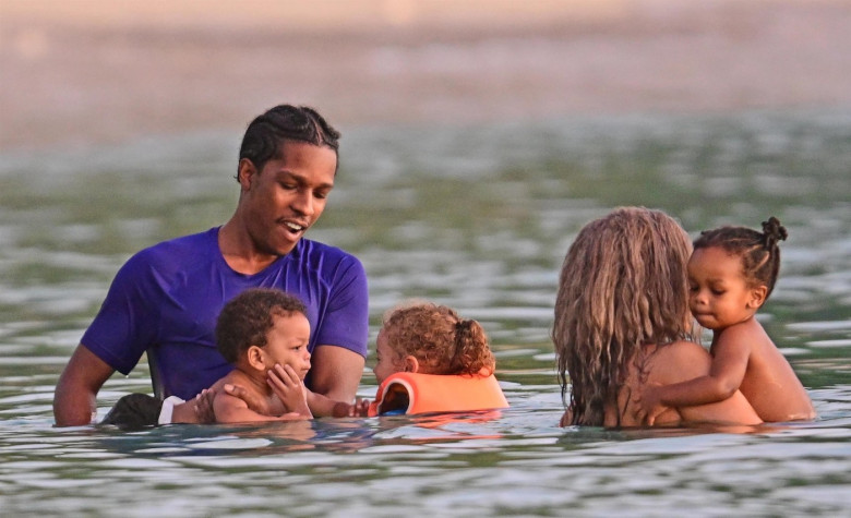 *PREMIUM-EXCLUSIVE* *MUST CALL FOR PRICING* The Grammy-Winning Superstar Rihanna wears her sultry black maxi beach dress watching the sun go down and taking a dip in the sea with her beau Asap Rocky during their family holiday in Barbados.**PICTURES TAKE