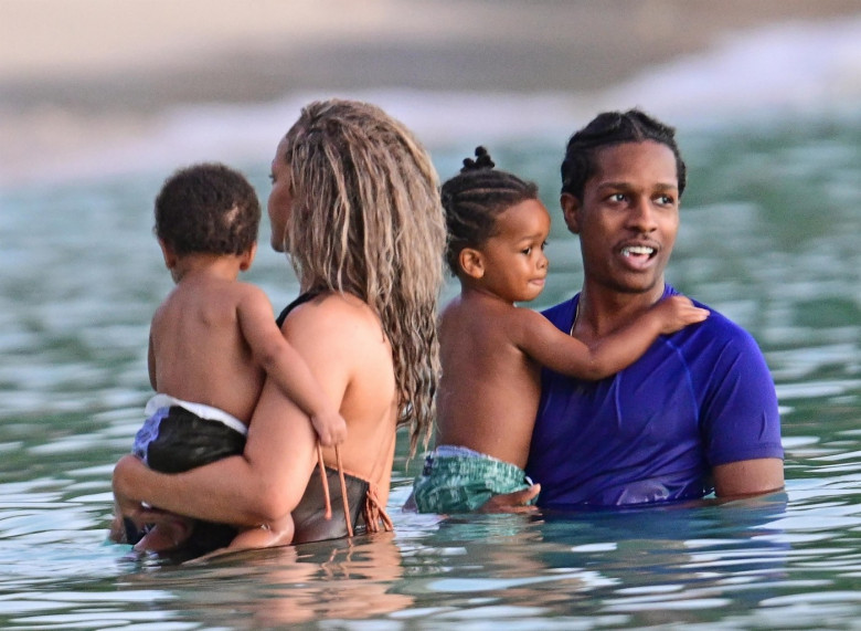 *PREMIUM-EXCLUSIVE* *MUST CALL FOR PRICING* The Grammy-Winning Superstar Rihanna wears her sultry black maxi beach dress watching the sun go down and taking a dip in the sea with her beau Asap Rocky during their family holiday in Barbados.**PICTURES TAKE