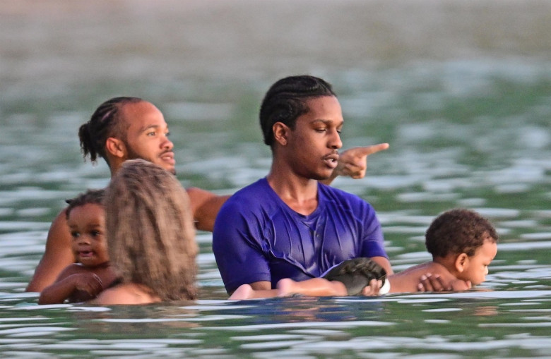 *PREMIUM-EXCLUSIVE* *MUST CALL FOR PRICING* The Grammy-Winning Superstar Rihanna wears her sultry black maxi beach dress watching the sun go down and taking a dip in the sea with her beau Asap Rocky during their family holiday in Barbados.**PICTURES TAKE