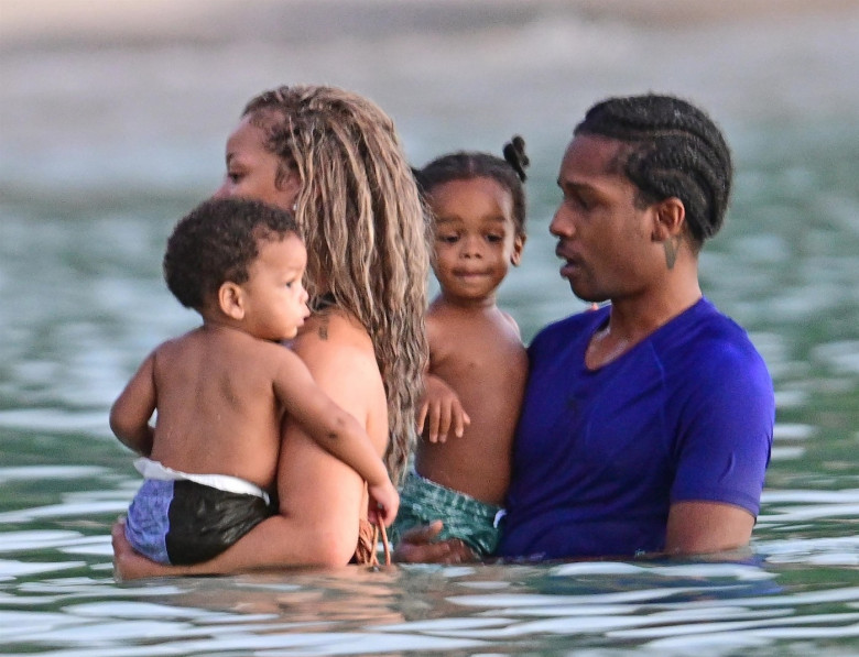 *PREMIUM-EXCLUSIVE* *MUST CALL FOR PRICING* The Grammy-Winning Superstar Rihanna wears her sultry black maxi beach dress watching the sun go down and taking a dip in the sea with her beau Asap Rocky during their family holiday in Barbados.**PICTURES TAKE