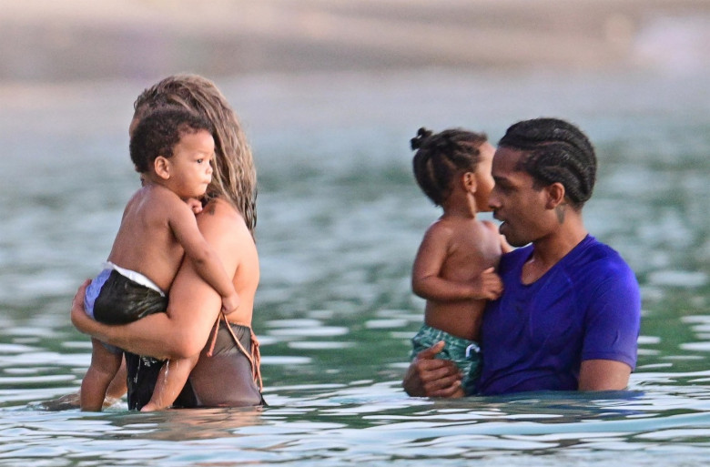 *PREMIUM-EXCLUSIVE* *MUST CALL FOR PRICING* The Grammy-Winning Superstar Rihanna wears her sultry black maxi beach dress watching the sun go down and taking a dip in the sea with her beau Asap Rocky during their family holiday in Barbados.**PICTURES TAKE