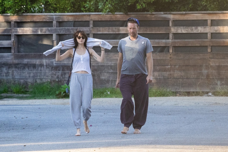 *EXCLUSIVE* Dakota Johnson takes a break from filming to be by Chris Martin's side as he recovers from lung infection that forced cancellation of some Coldplay shows! - ** WEB MUST CALL FOR PRICING **