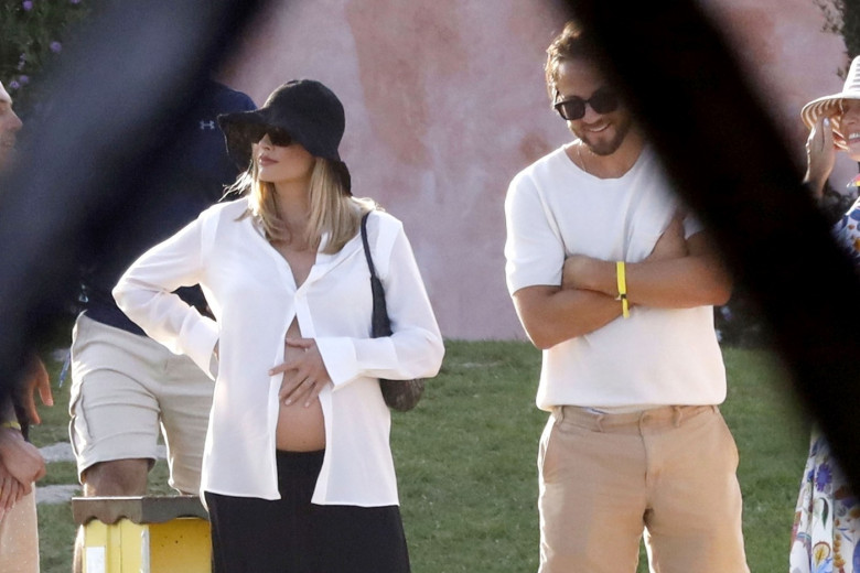 *PREMIUM-EXCLUSIVE* MUST CALL FOR PRICING BEFORE USAGE  - Heavily pregnant Australian actress Margot Robbie looks radiant as she shows off her growing baby bump while pictured with her husband Tom Ackerley and friends enjoying summer vacation in Sardinia.