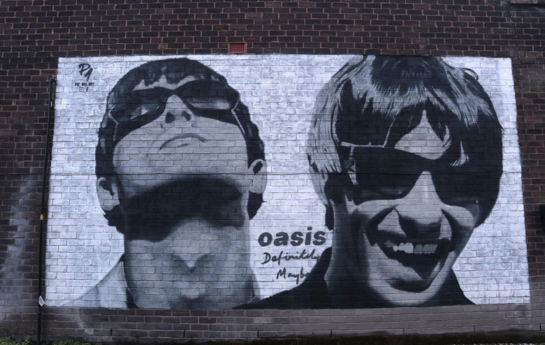 Mural of Oasis band members Liam &amp; Noel Gallagher on a wall in Burnage