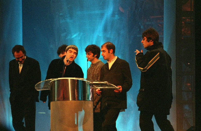 OASISBritish Rock Group.Seen with their Brit Award forBest British Newcomer.From Left to Right:-Back) TONY McCARROLL.Front) Talking, NOEL GALLAGHER: PAUL McGUIGAN: PAUL "BONEHEAD" ARTHURS: LIAM GALLAGHER.COMPULSORY CREDIT: UPPA/PhotoshotP