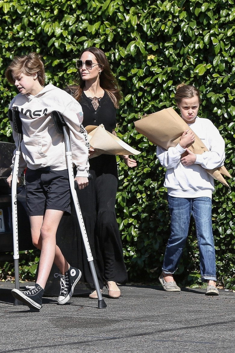 *EXCLUSIVE* Angelina Jolie looks classy in a maxi black dress while out buying flowers **WEB MUST CALL FOR PRICING**