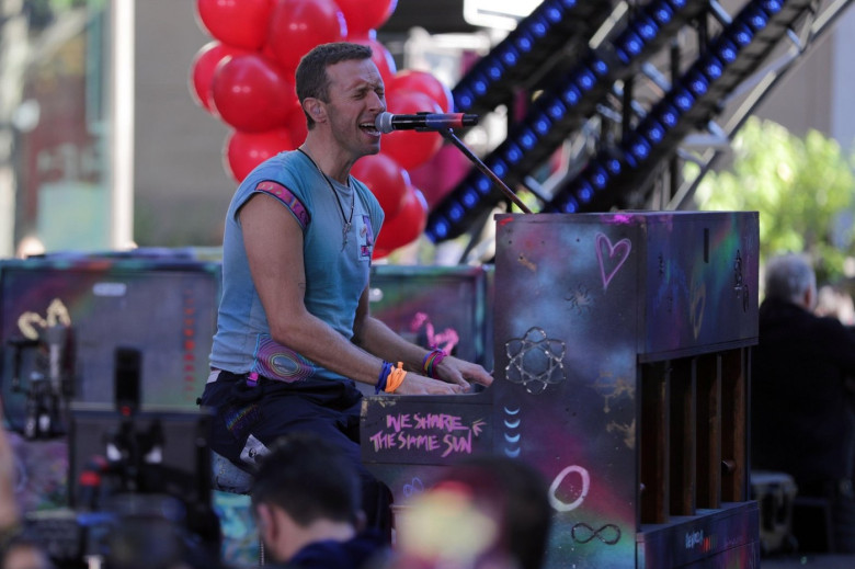 NEW YORK, NEW YORK - OCTOBER 08: Chris Martin of Coldplay performs live on NBC's "Today" show at Rockefeller Plaza on October 08, 2024, in New York City. The British rock band delivered an energetic performance, captivating the audience with their hit son