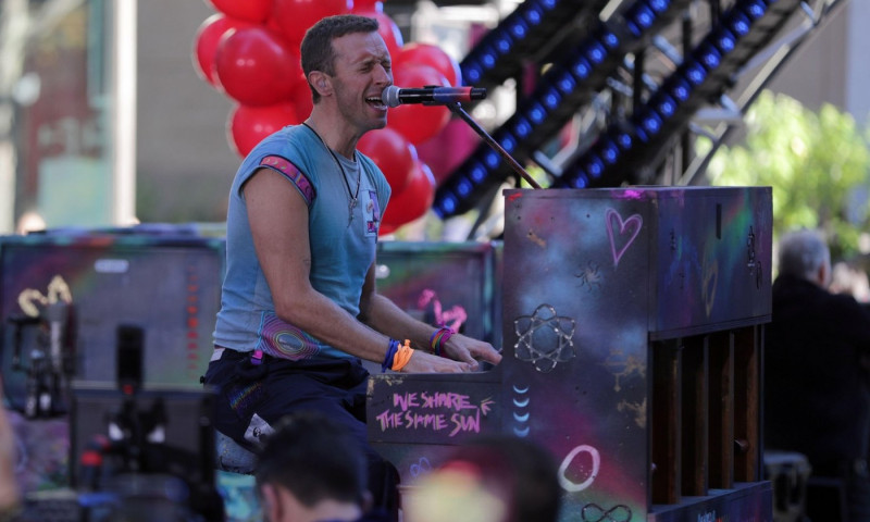 NEW YORK, NEW YORK - OCTOBER 08: Chris Martin of Coldplay performs live on NBC's "Today" show at Rockefeller Plaza on October 08, 2024, in New York City. The British rock band delivered an energetic performance, captivating the audience with their hit son