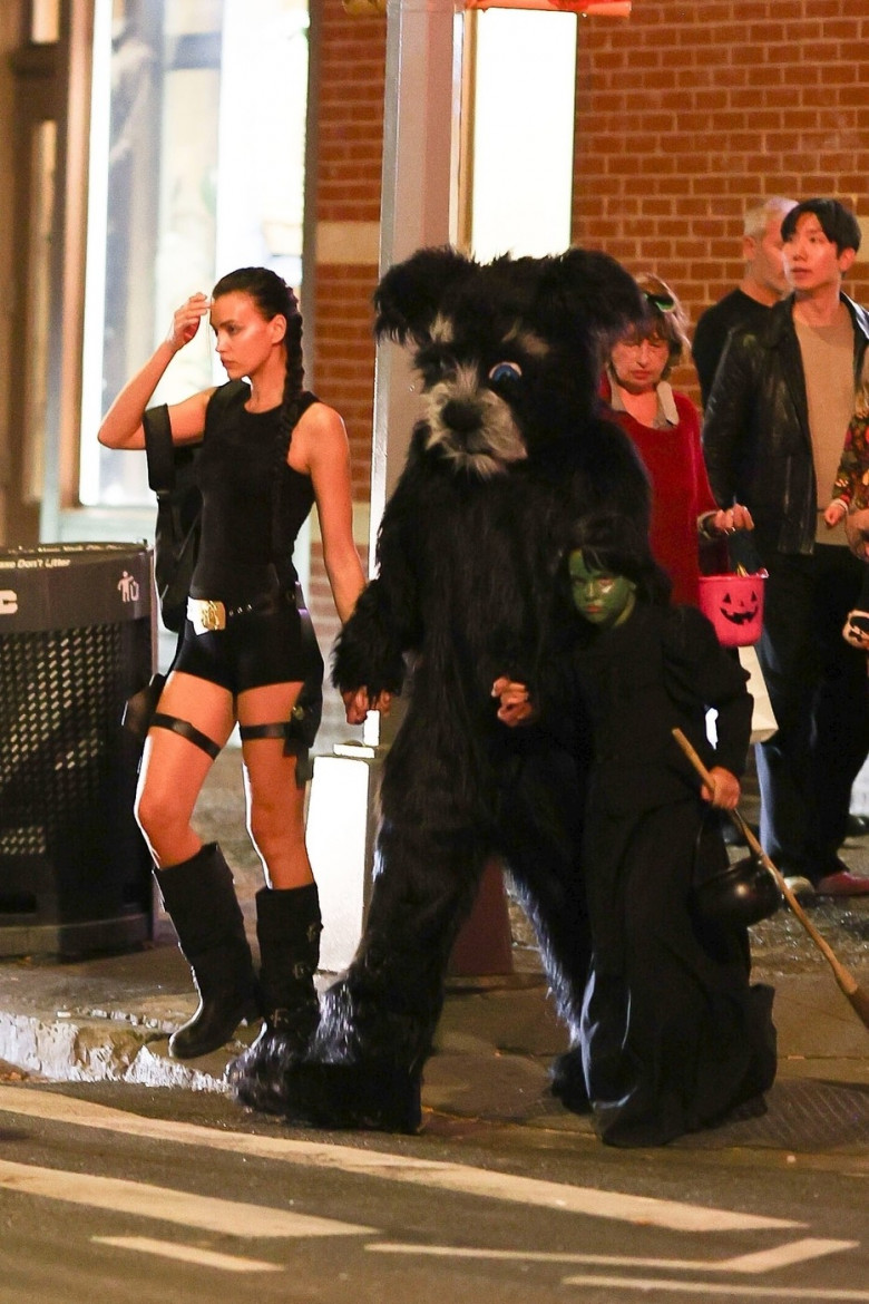 Irina Shayk costumes up as Lara Croft while trick-or-treating with Bradley Cooper and daughter Lea in NYC