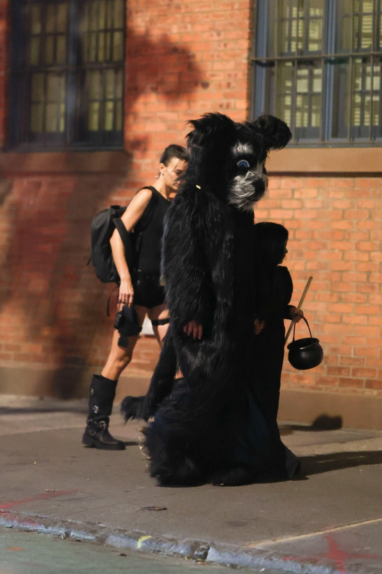 Irina Shayk costumes up as Lara Croft while trick-or-treating with Bradley Cooper and daughter Lea in NYC