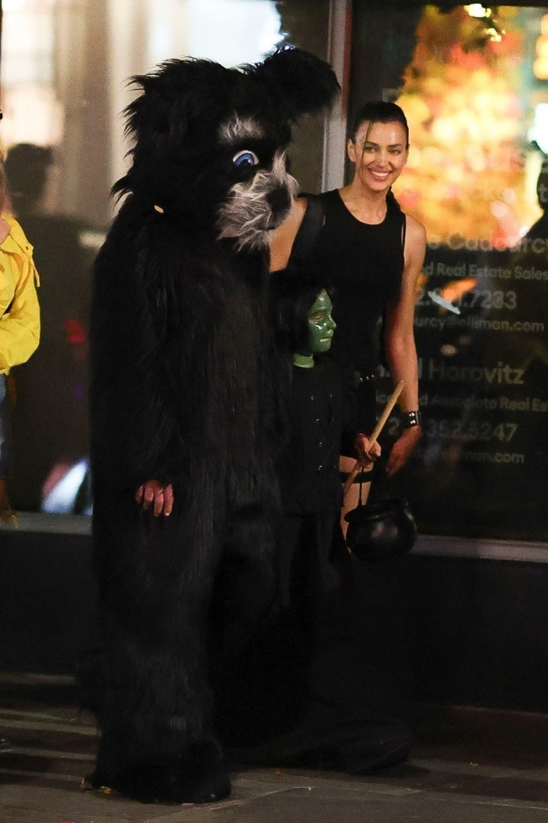 Irina Shayk costumes up as Lara Croft while trick-or-treating with Bradley Cooper and daughter Lea in NYC