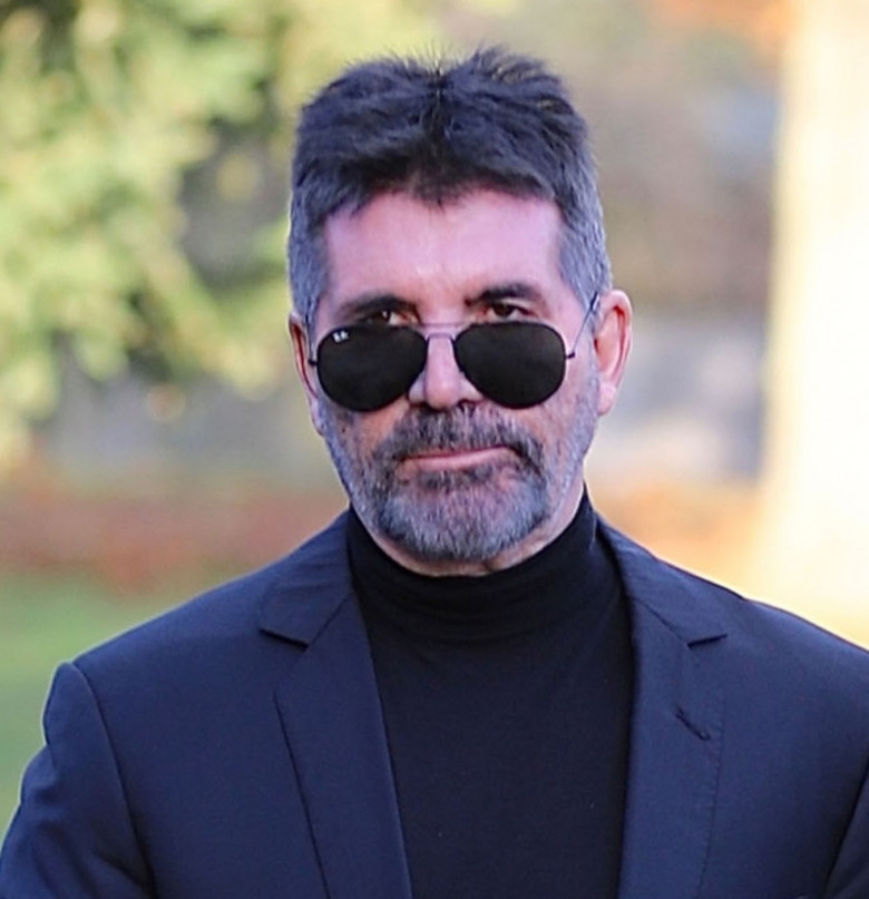 Simon Cowell and his partner Lauren Silverman leaving the Funeral of the Former One Direction star Liam Payne at St Mary’s Church in Amersham, Buckinghamshire.