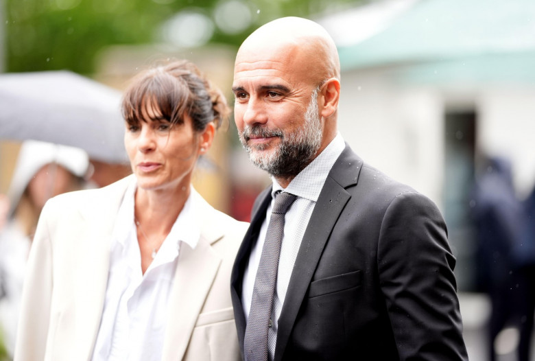 Manchester City manager Pep Guardiola with his wife Cristina Serra on day six of the 2024 Wimbledon Championships at the All England Lawn Tennis and Croquet Club, London. Picture date: Saturday July 6, 2024.