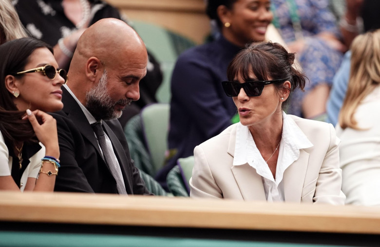 Manchester City manager Pep Guardiola with his wife Cristina Serra on day six of the 2024 Wimbledon Championships at the All England Lawn Tennis and Croquet Club, London. Picture date: Saturday July 6, 2024.