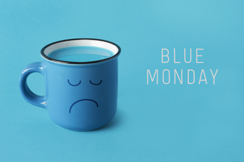 blue mug with sad face and text blue monday