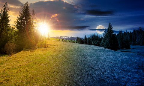 mountain landscape with sun and moon at spring equinox