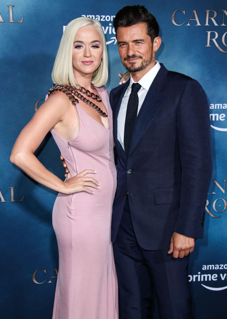 (FILE) Katy Perry Receives Backlash After Blue Origin Space Flight. HOLLYWOOD, LOS ANGELES, CALIFORNIA, USA - AUGUST 21: Singer Katy Perry and fiance/actor Orlando Bloom arrive at the Los Angeles Premiere Of Amazon's 'Carnival Row' held at the TCL Chinese