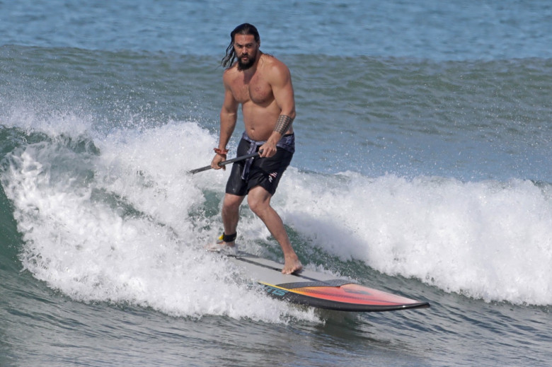 EXCLUSIVE: Aquaman star Jason Momoa shows off his ripped body as he hits the surf in Hawaii