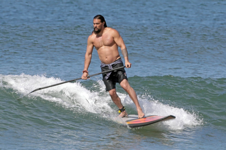 EXCLUSIVE: Aquaman star Jason Momoa shows off his ripped body as he hits the surf in Hawaii