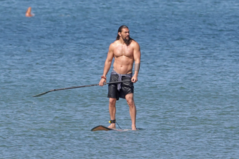 EXCLUSIVE: Aquaman star Jason Momoa shows off his ripped body as he hits the surf in Hawaii