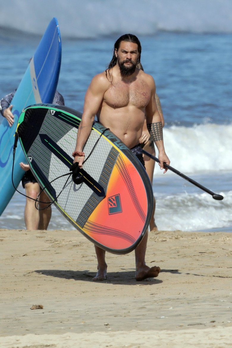 EXCLUSIVE: Aquaman star Jason Momoa shows off his ripped body as he hits the surf in Hawaii
