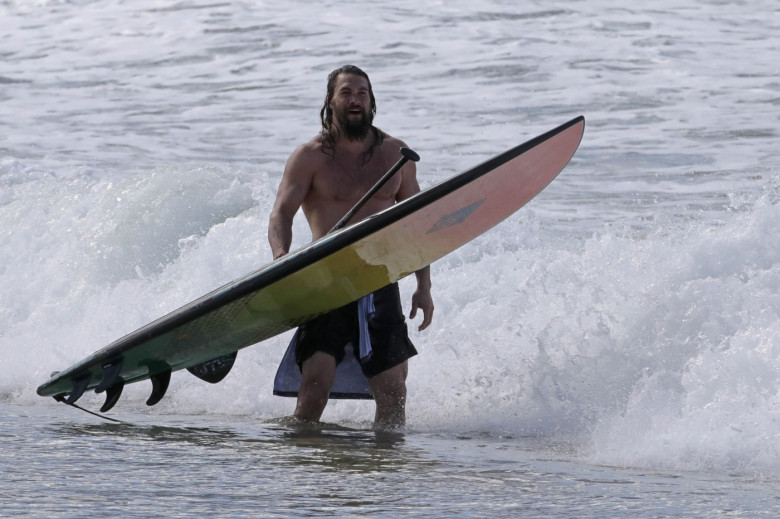 EXCLUSIVE: Aquaman star Jason Momoa shows off his ripped body as he hits the surf in Hawaii