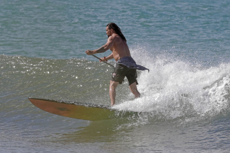 EXCLUSIVE: Aquaman star Jason Momoa shows off his ripped body as he hits the surf in Hawaii