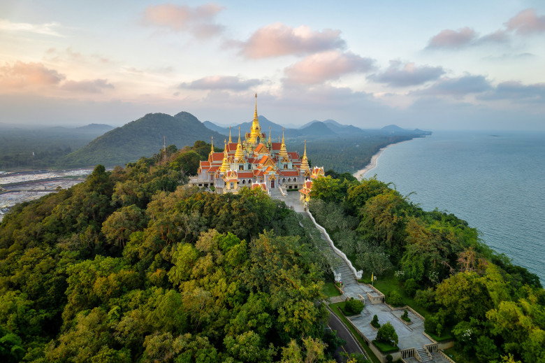 Aerial Drone Sunset Scene of Pagodas at Pramahatart Chedi Pakdepragard, Wat Tang Sai temple, Ban Krut, Bang Saphan, Prachuap Khirikhan, Thailand