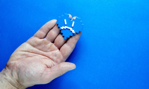 Blue Monday Concept. Hands of a man holding a blue heart.