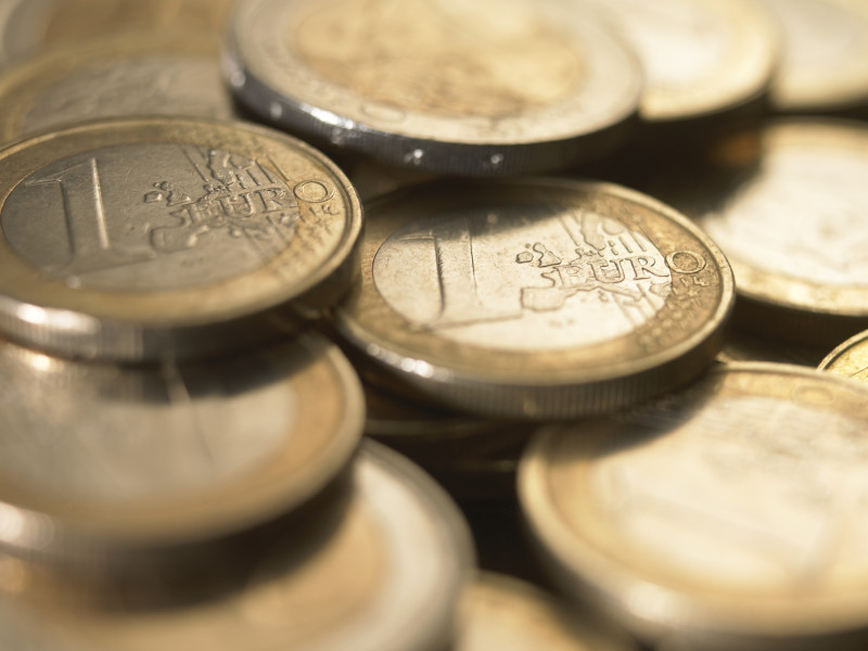 Euro Currency: Pile of 1 euro coins, close-up