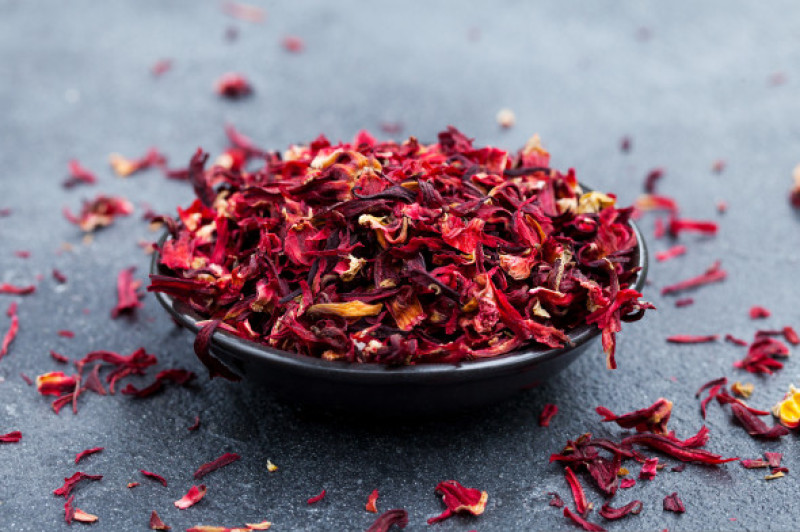 Hibiscus,Tea,In,Black,Bowl.,Slate,Background.,Copy,Space.