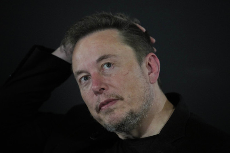 Tesla and SpaceX's CEO Elon Musk reacts during an in-conversation event with Britain's Prime Minister Rishi Sunak in London, Thursday, Nov. 2, 2023. Sunak discussed AI with Elon Musk in a conversation that is played on the social network X, which Musk own