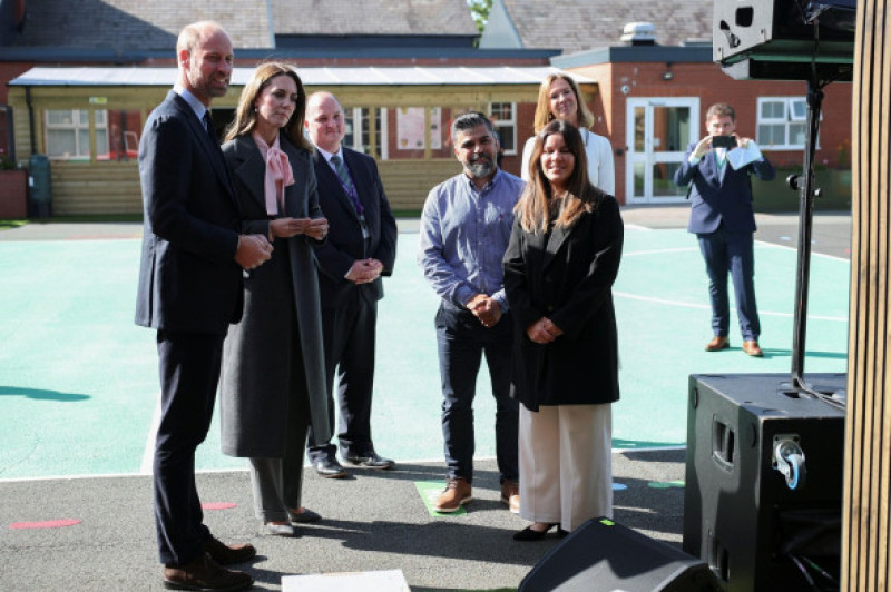 RETRANSMITTING ADDING CAPTION INFORMATION The Prince and Princess of Wales speak with Alice da Silva Aguiar's parents Sergio and Alex during a visit to Churchtown Primary School in Southport, to see the new commemorative playground that has been created t