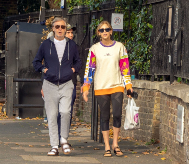 *EXCLUSIVE* *STRICTLY NO WEB USE UNTIL 22:00 HRS UK TIME ON 15/10/22*Romance is in the air as Sir Paul McCartney and his colourfully dressed wife Nancy Shevell walk arm-in-arm through the leaves on a sunny day in London.