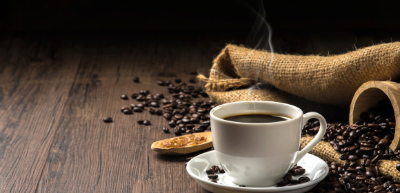 Hot,Coffee,In,A,White,Coffee,Cup,And,Many,Coffee