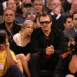 Michelle Williams and Heath Ledger watch the L.A. Lakers