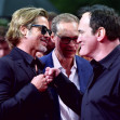 Berlin, Germany. 01st Aug, 2019. US director Quentin Tarantino (r) and actor Brad Pitt (l) welcome each other before the premiere of their movie "Once upon a time.in Hollywood". Between them stands Berlin's Governing Mayor Michael Mller (SPD). The Hollywo