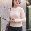 *EXCLUSIVE* Suri Cruise enjoys a spring time solo stroll in New York with headphones. Looking relaxed and sporty in short shorts and sneakers.