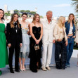 Jena Malone, Isabelle Fuhrman, Ella Hunt, Georgia MacPhail, Kevin Costner, Sienna Miller, Abbey Lee Kershaw and Wase Chief pose at the photo call of 'Horizon: An American Saga' during the 77th Cannes Film Festival at Palais des Festivals in Cannes, France
